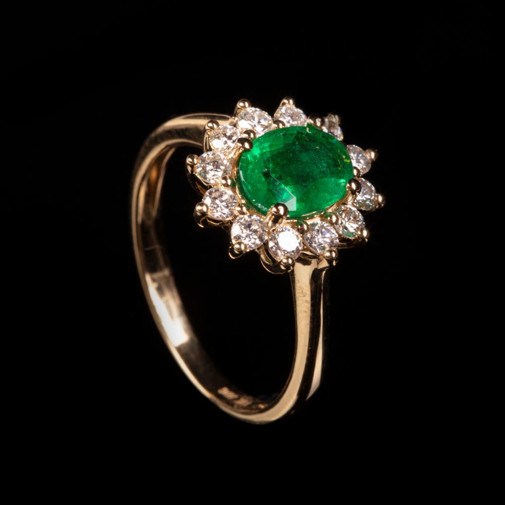 Appraisal: kt Yellow Gold Emerald and Diamond Ring center oval mixed-cut