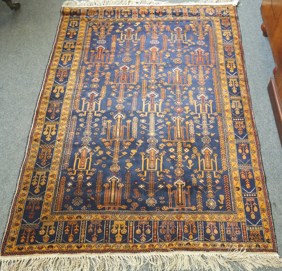 Appraisal: A Beluchistan rug the indigo field with stylised plants minor