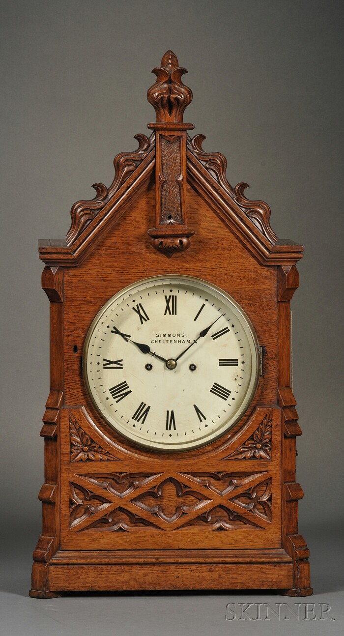 Appraisal: Gothic Oak Table Clock by Simmons Cheltenham c the Gothic