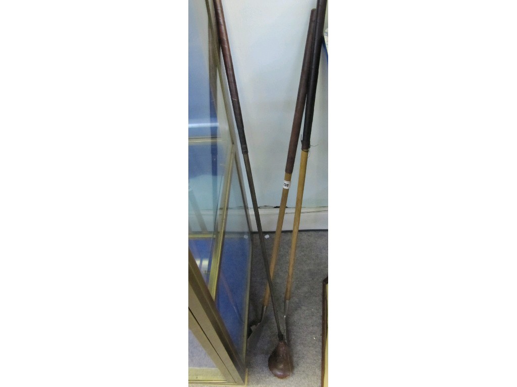 Appraisal: Lot comprising three hickory shafted golf clubs