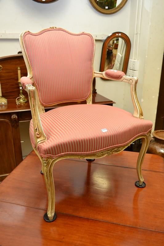 Appraisal: A LOUIS XV STYLE OPEN ARMCHAIR IN STRIPED PINK UPHOLSTERY