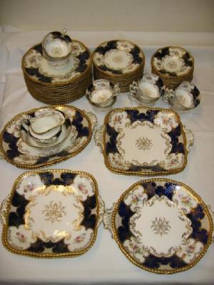 Appraisal: A COALPORT TEA AND DESSERT SERVICE for twelve settings comprising