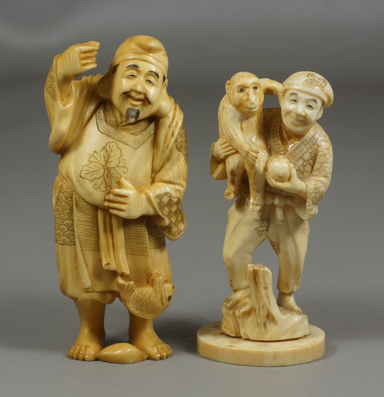 Appraisal: carved ivory figures man with fish missing pole signed man