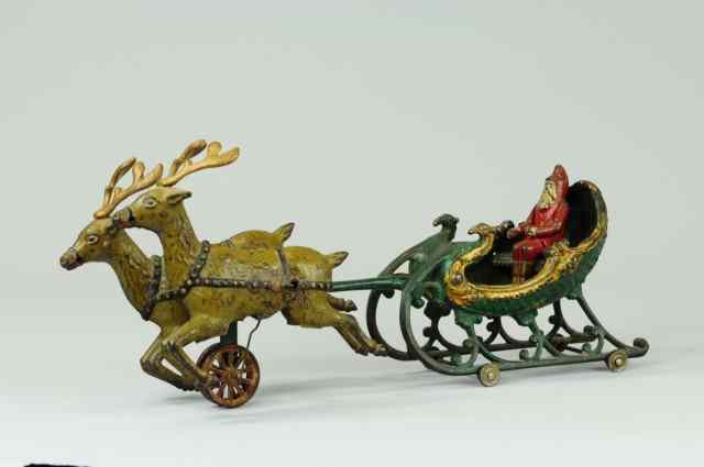 Appraisal: SANTA SLEIGH WITH WHITE REINDEER Hubley cast iron open sleigh