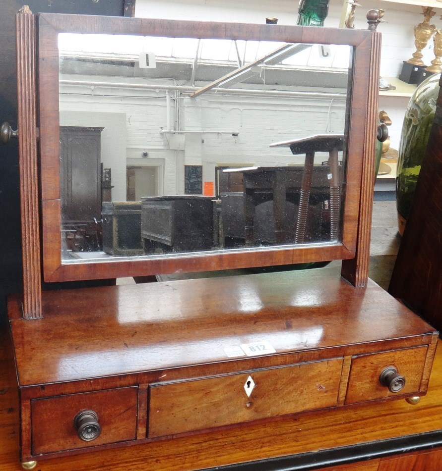 Appraisal: A George III mahogany toilet mirror with three drawer base