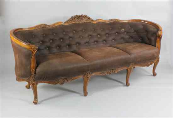 Appraisal: An Anglo-Indian carved teak button back settee with leather upholstery