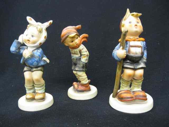 Appraisal: Hummel Figurines ''Boy with Toothache'' ''March Winds'' and ''Little Hiker''