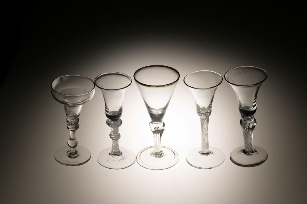 Appraisal: LIGHT BALUSTER PAN-TOP WINE GLASS with beaded knop between collars