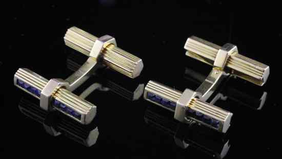 Appraisal: A pair of gold and sapphire set hexagonal baton cufflinks