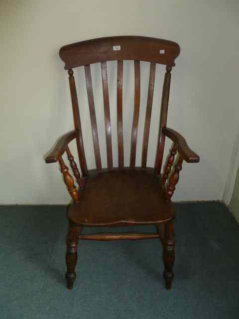 Appraisal: A TH CENTURY ELM AND BEECHWOOD WINDSOR LATH BACK ARMCHAIR