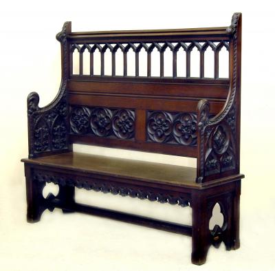 Appraisal: A VICTORIAN GOTHIC CARVED OAK PEW the moulded top rail