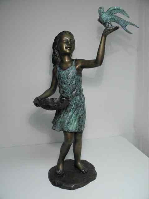 Appraisal: Bronze sculpture depicting a girl with a bird in one