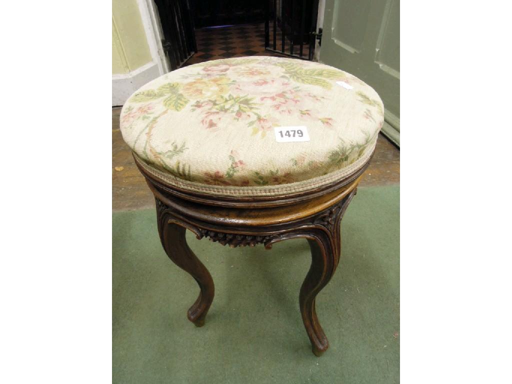 Appraisal: A th century walnut piano stool with circular upholstered revolving