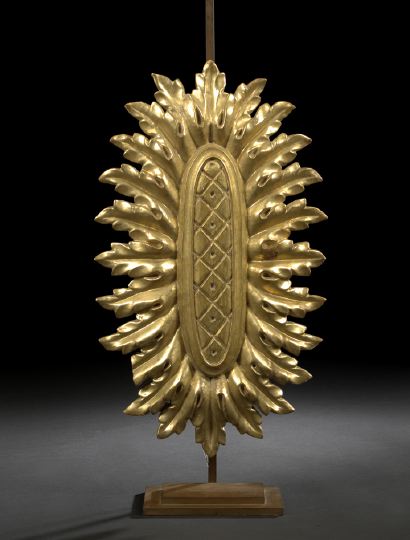 Appraisal: Large Italian Carved Giltwood Elliptical Votive Sunburst in the neoclassical