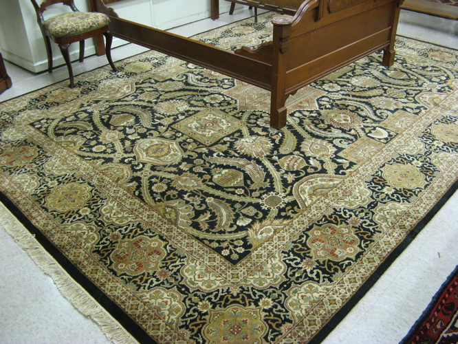 Appraisal: HAND KNOTTED ORIENTAL CARPET panel medallion and overall flower and