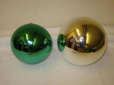 Appraisal: TWO LARGE WITCHES BALLS in green and silver with moulded