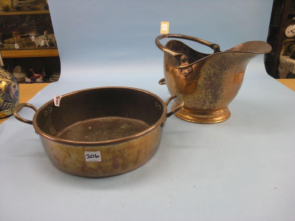 Appraisal: A Victorian copper helmet-shape coal scuttle and a Victorian two-handled