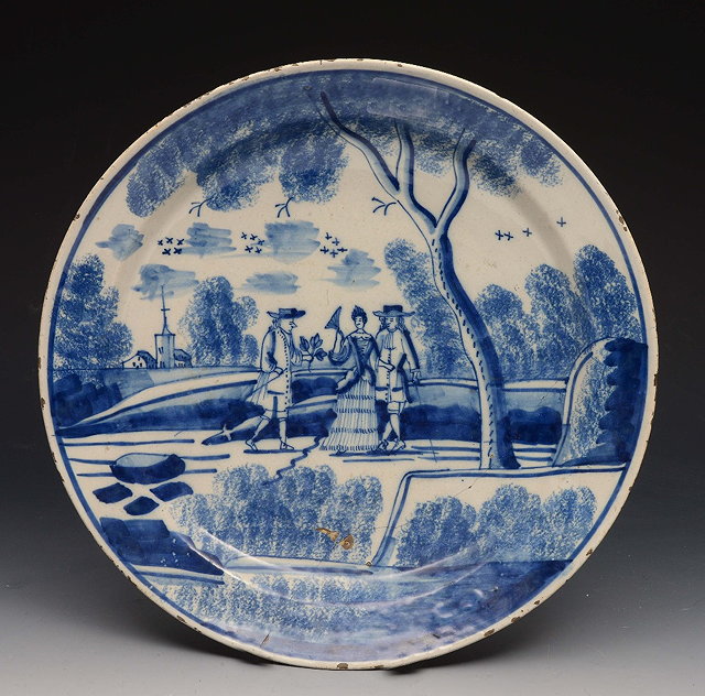 Appraisal: A DELFT BLUE AND WHITE CIRCULAR DISH decorated three figures