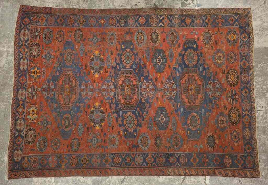 Appraisal: Caucasian rug Red and blue filed with geometric motifs and