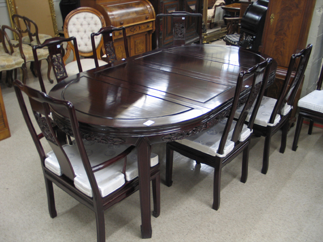 Appraisal: CHINESE ROSEWOOD DINING TABLE AND CHAIR SET comprising round extension