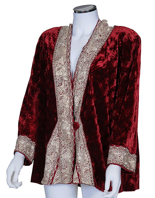 Appraisal: A mid th Centuy red velvet jacket with a white