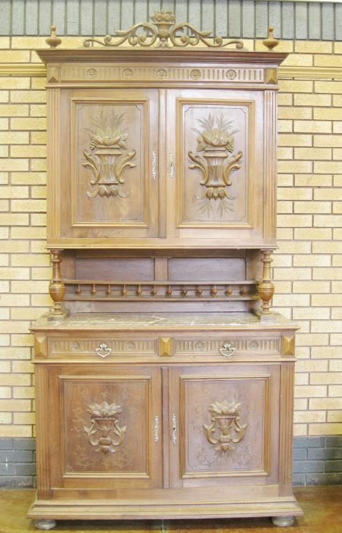 Appraisal: A French walnut Buffet having pair of carved panelled doors