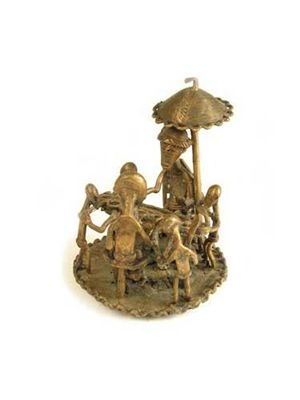 Appraisal: A West African brass group of a family playing mankala