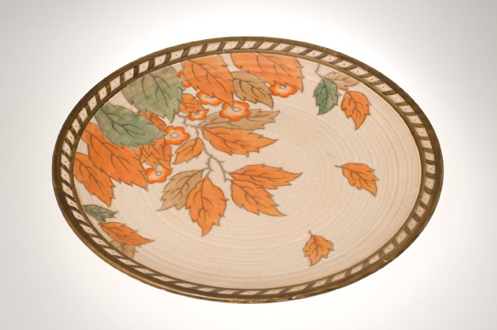 Appraisal: CROWN DUCAL GOLDEN LEAVES PATTERN CHARGER DESIGNED BY CHARLOTTE RHEAD