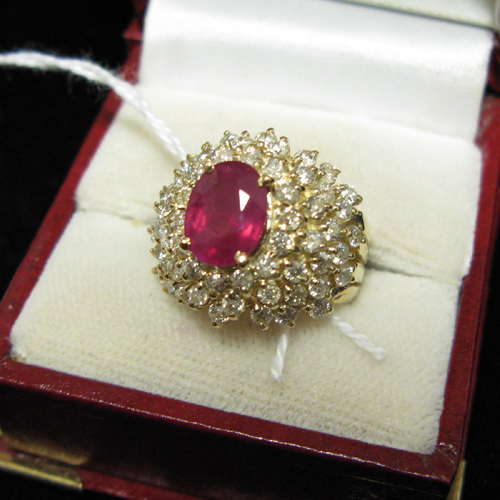 Appraisal: DIAMOND RUBY AND FOURTEEN KARAT GOLD DINNER RING having a