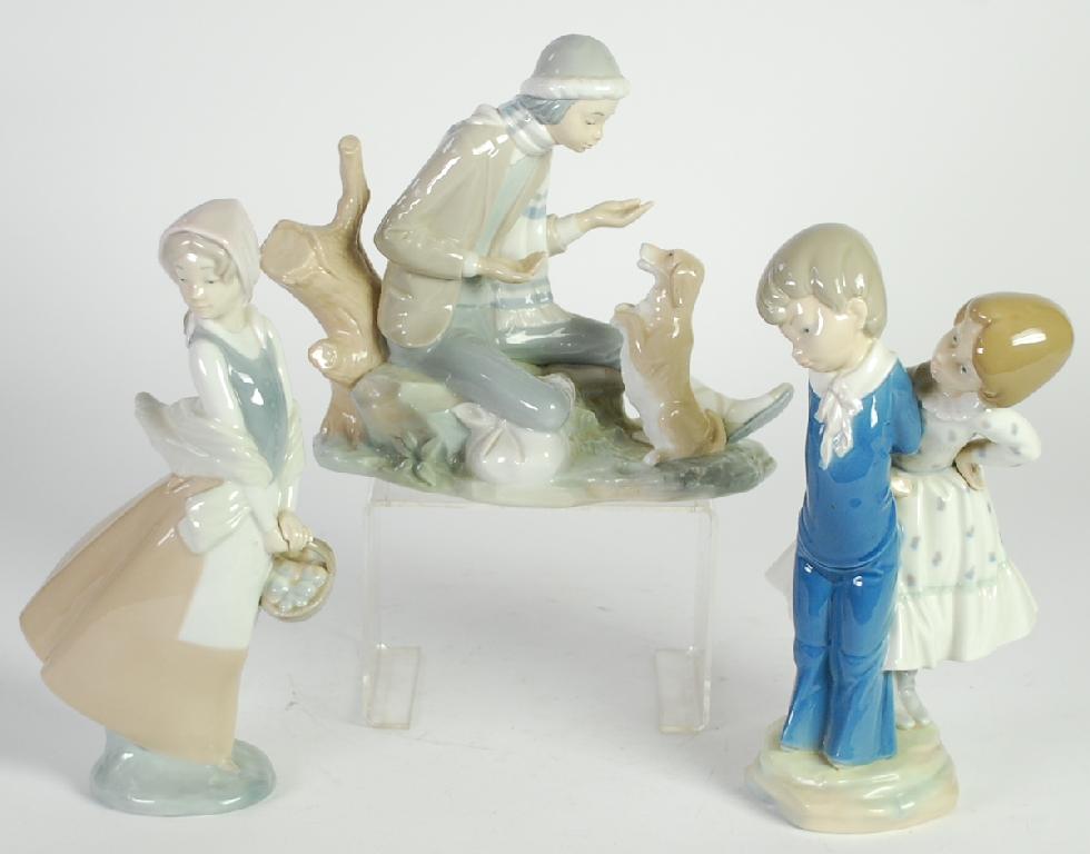 Appraisal: THREE NAO SPANISH PORCELAIN FIGURES comprising ONE MODELLED AS A