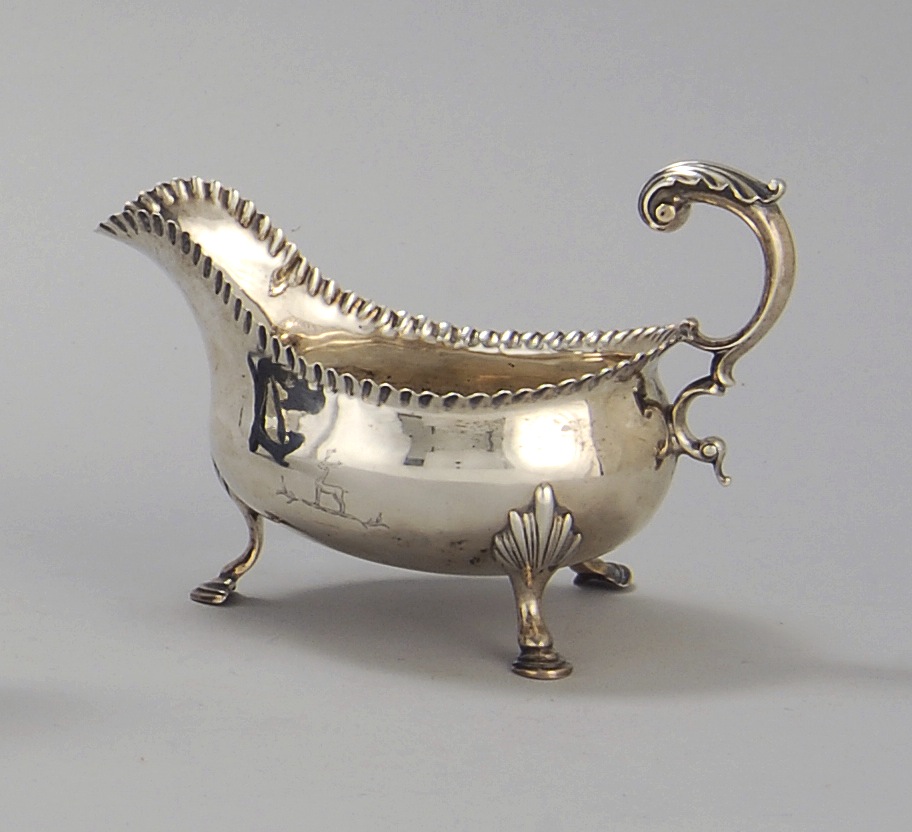 Appraisal: ENGLISH SILVER SAUCEBOAT London In boat form with scalloped edge