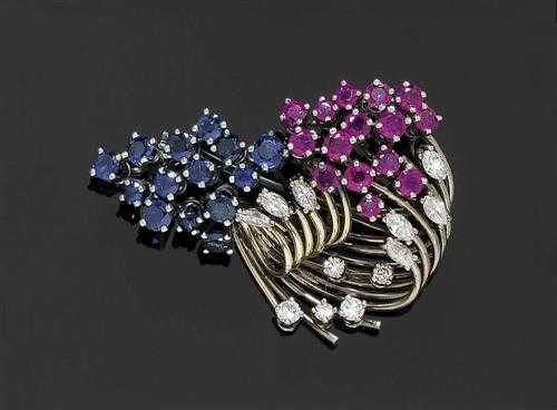 Appraisal: SAPPHIRE RUBY AND DIAMOND BROOCH White gold Elegant brooch in