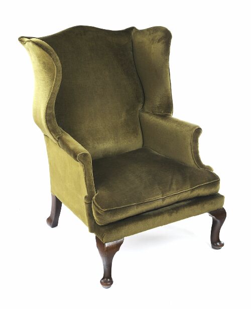 Appraisal: An upholstered wing armchair of George II style the arched