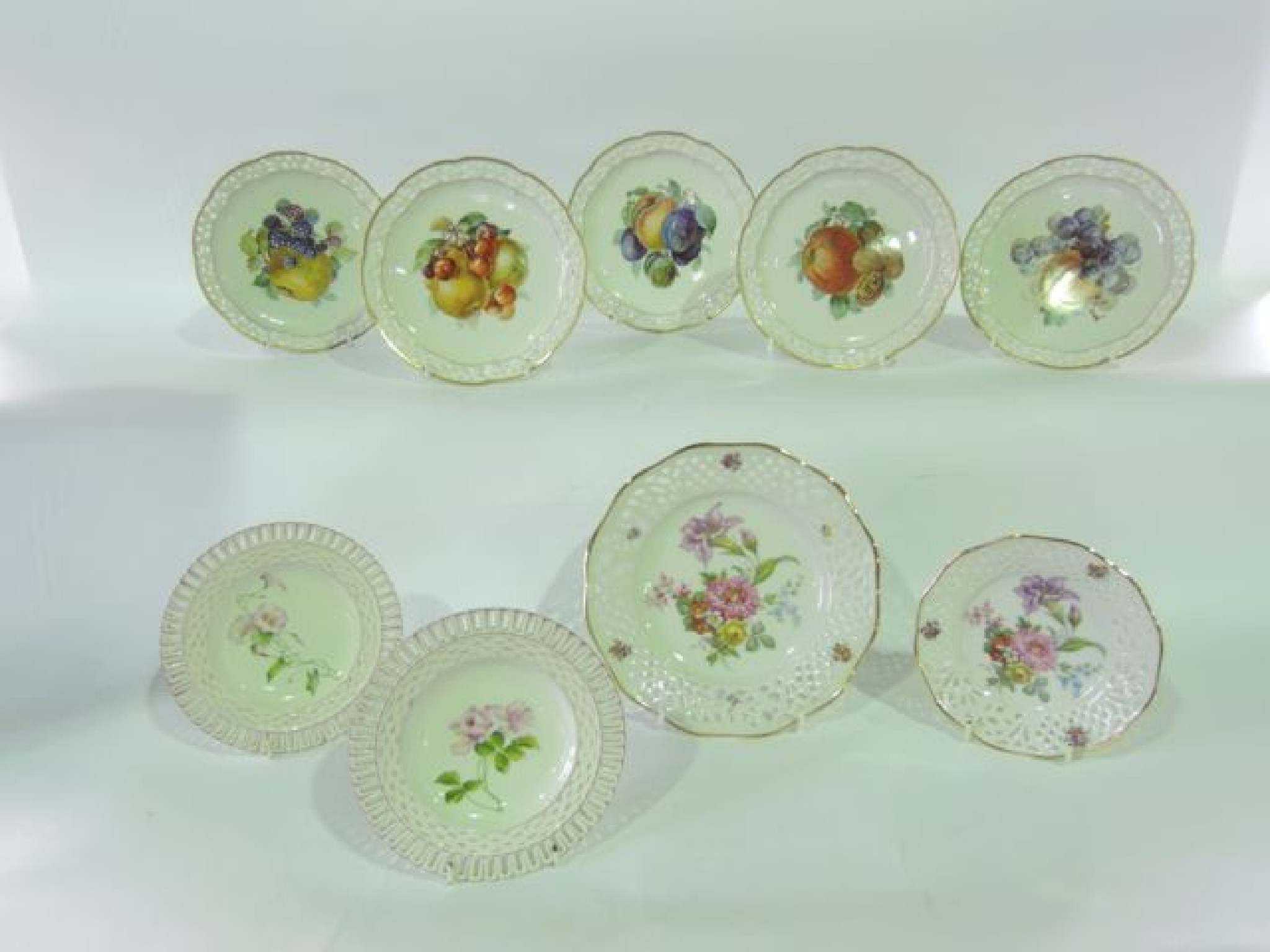 Appraisal: A set of five Bavarian dessert plates with pierced borders