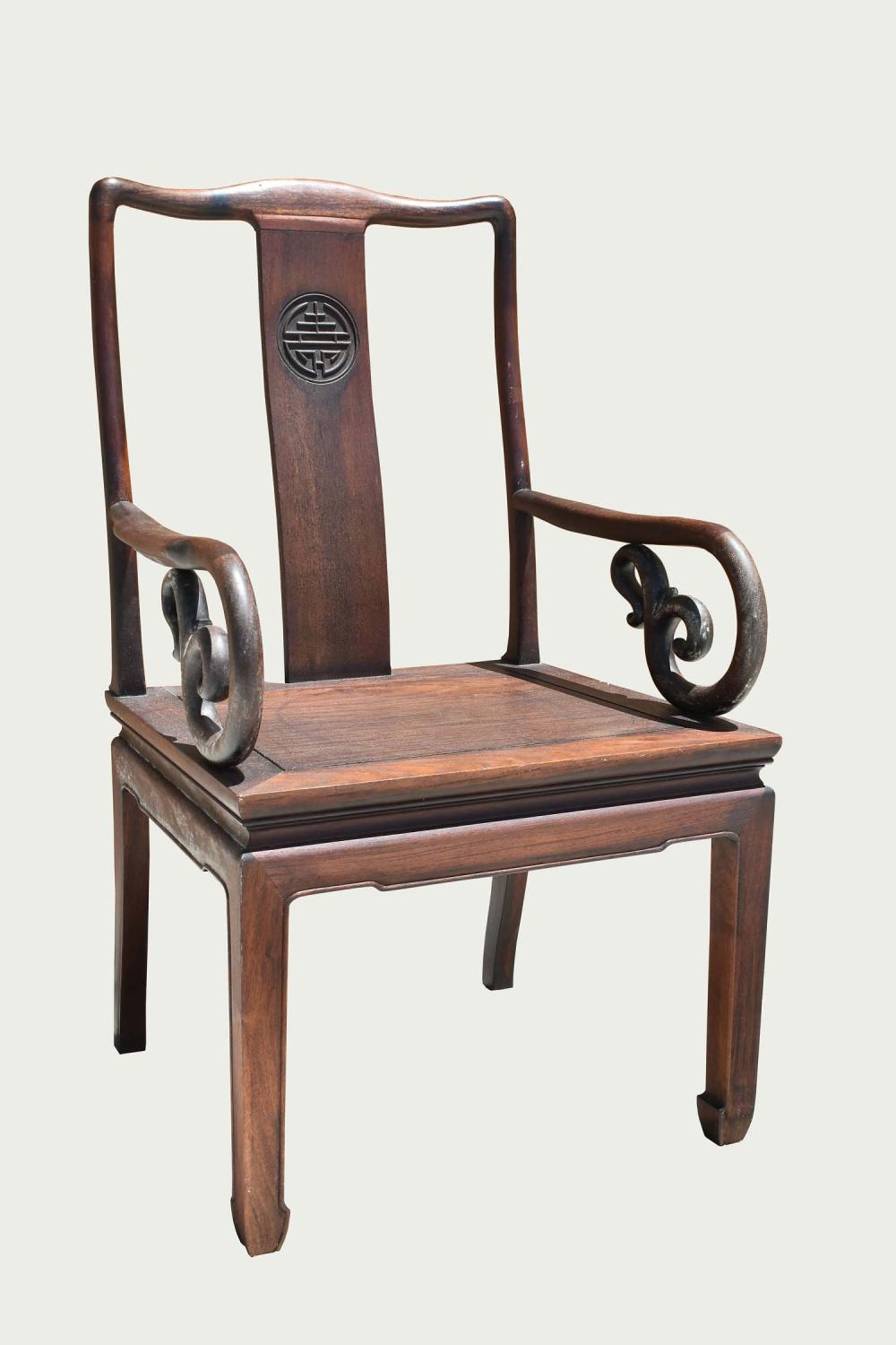 Appraisal: CHINESE CLASSICAL STYLE HARDWOOD ARMCHAIRThe rounded stiles with a center