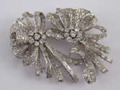 Appraisal: A white metal tests platinum diamond double clip brooch of