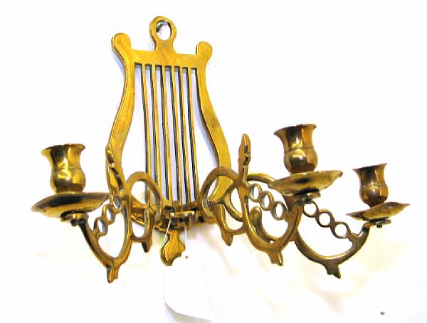 Appraisal: A pair of Baroque style brass three-light sconces th century