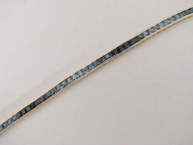 Appraisal: Lady's k yellow gold line bracelet with invisible set sapphires