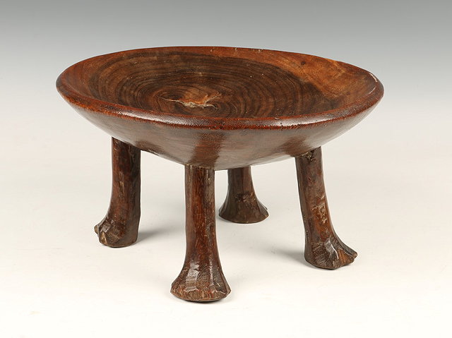 Appraisal: AN AFRICAN TRIBAL CARVED HARDWOOD STOOL with circular top and