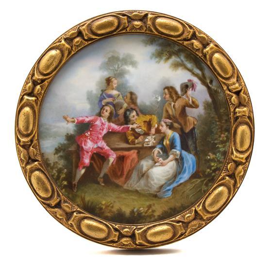 Appraisal: Continental Porcelain Plaque of circular form depicting revelers in a