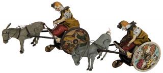 Appraisal: Pair of Lehmann Circus Chariot Key-Wind Toys Antique German toy