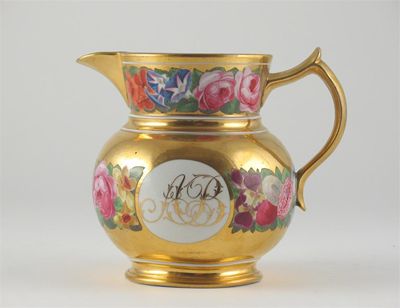 Appraisal: A bone china jug painted with bands of flowers on