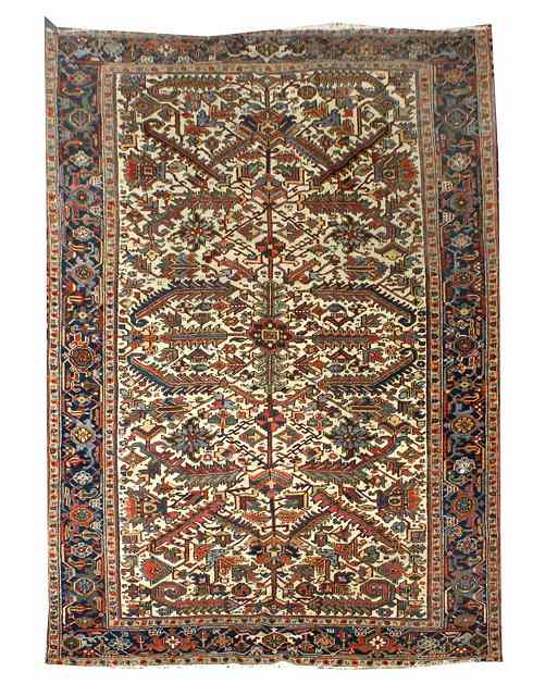 Appraisal: A HERIZ WHITE GROUND CARPET with an all over polychrome