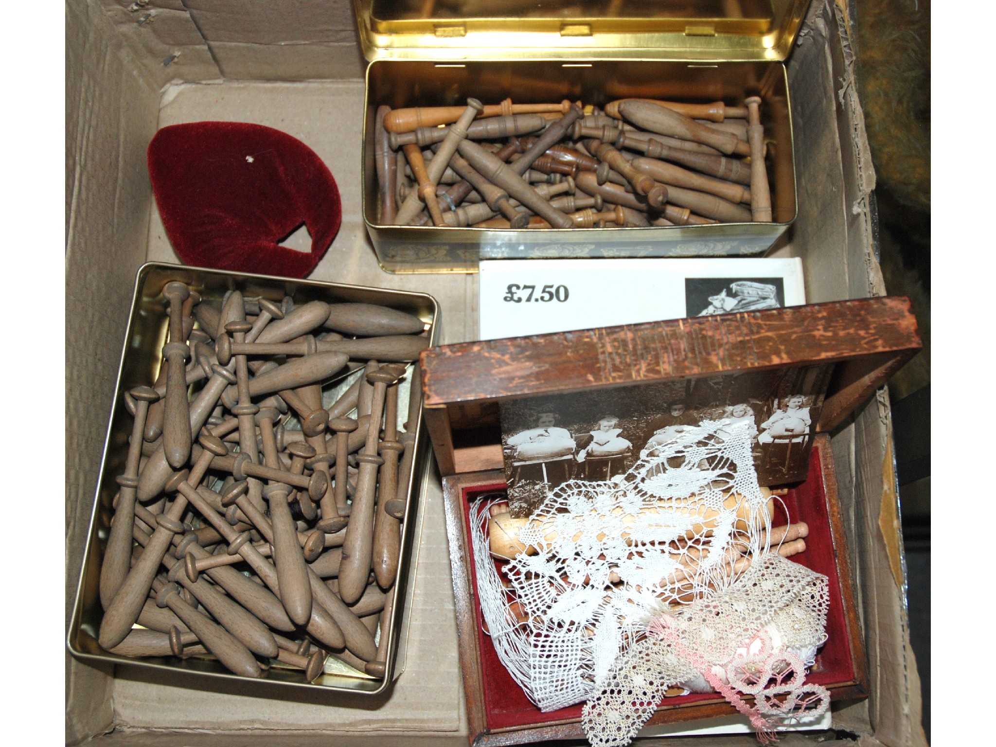 Appraisal: A collection of lace making tools and bobbins and lace