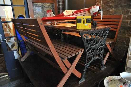 Appraisal: AN OUTDOOR TABLE WITH CAST IRON SIDES AND TWO BENCH