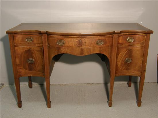 Appraisal: George III mahogany and boxwood crossbanded serpentine sideboard with four