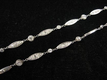 Appraisal: Platinum and diamond opera length necklace Twenty-eight navette shape links