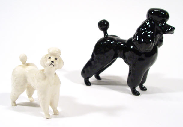 Appraisal: Large hand painted Beswick black glazed poodle and a smaller