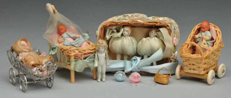 Appraisal: Lot of Dolls in Beds or Carriages Description s Germany