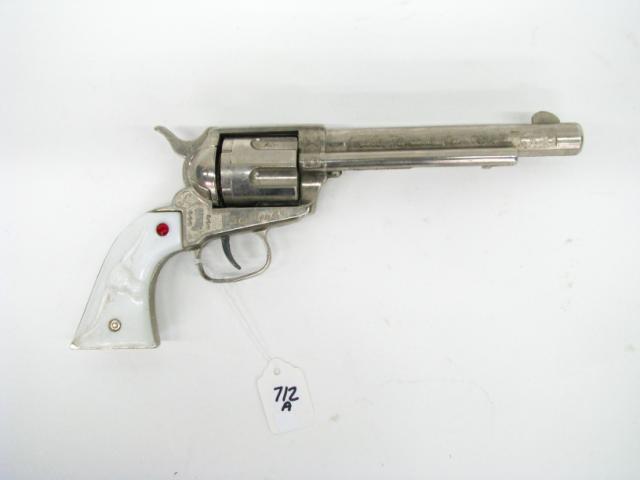 Appraisal: Nichols Stallion Cap Pistol six-shot revolver embossed frame with wild